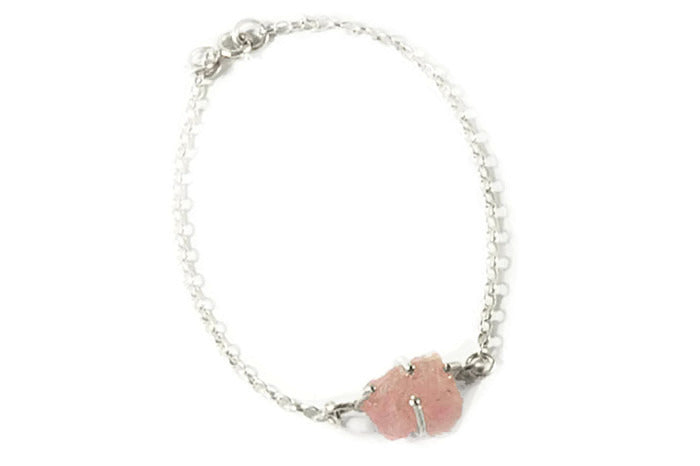 Semi-precious un-cut gemstone set in sterling silver claws with silver bracelet chain