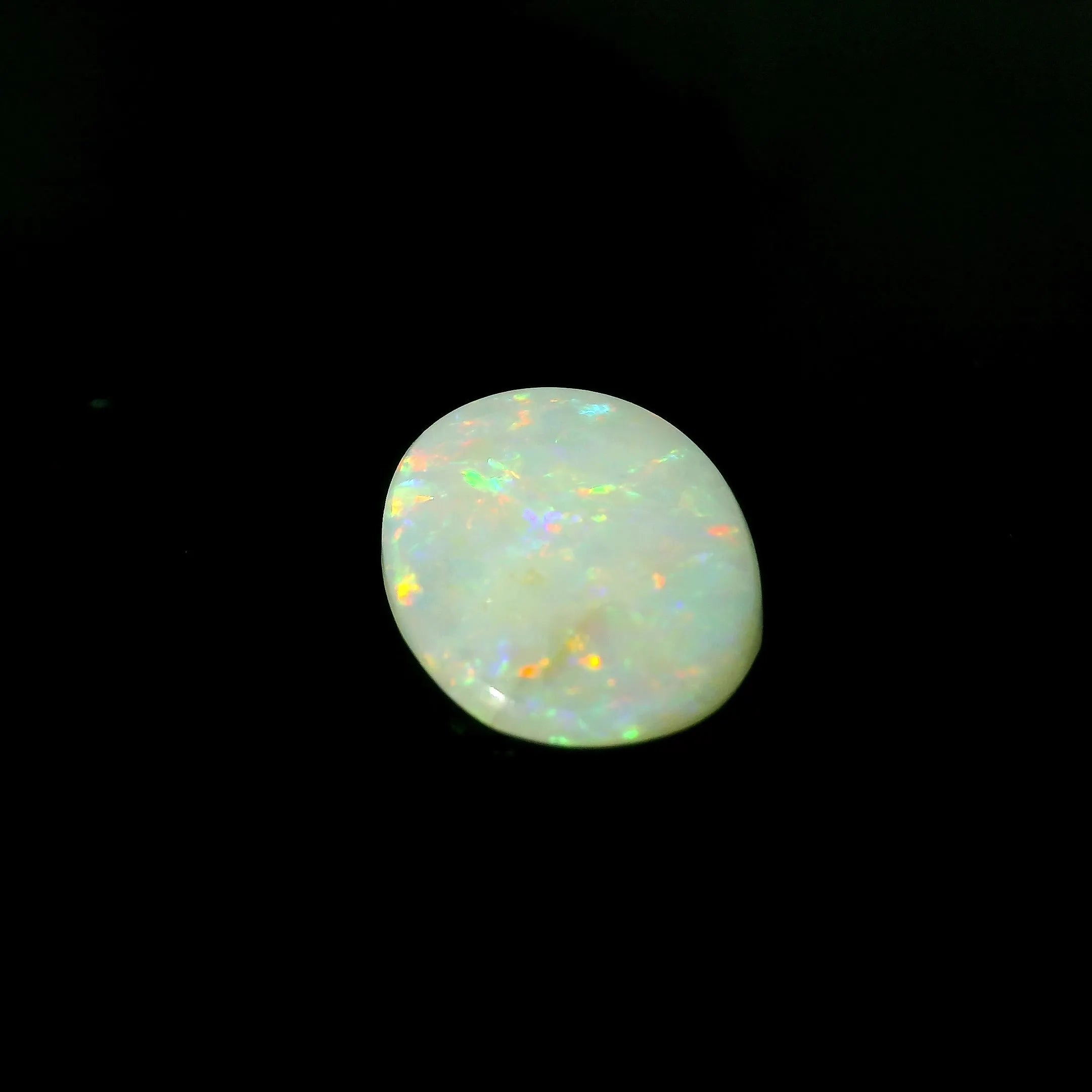 2.47ct Oval Natural Opal (Colour White, Clarity Moderately Included, Cut Cabochon)